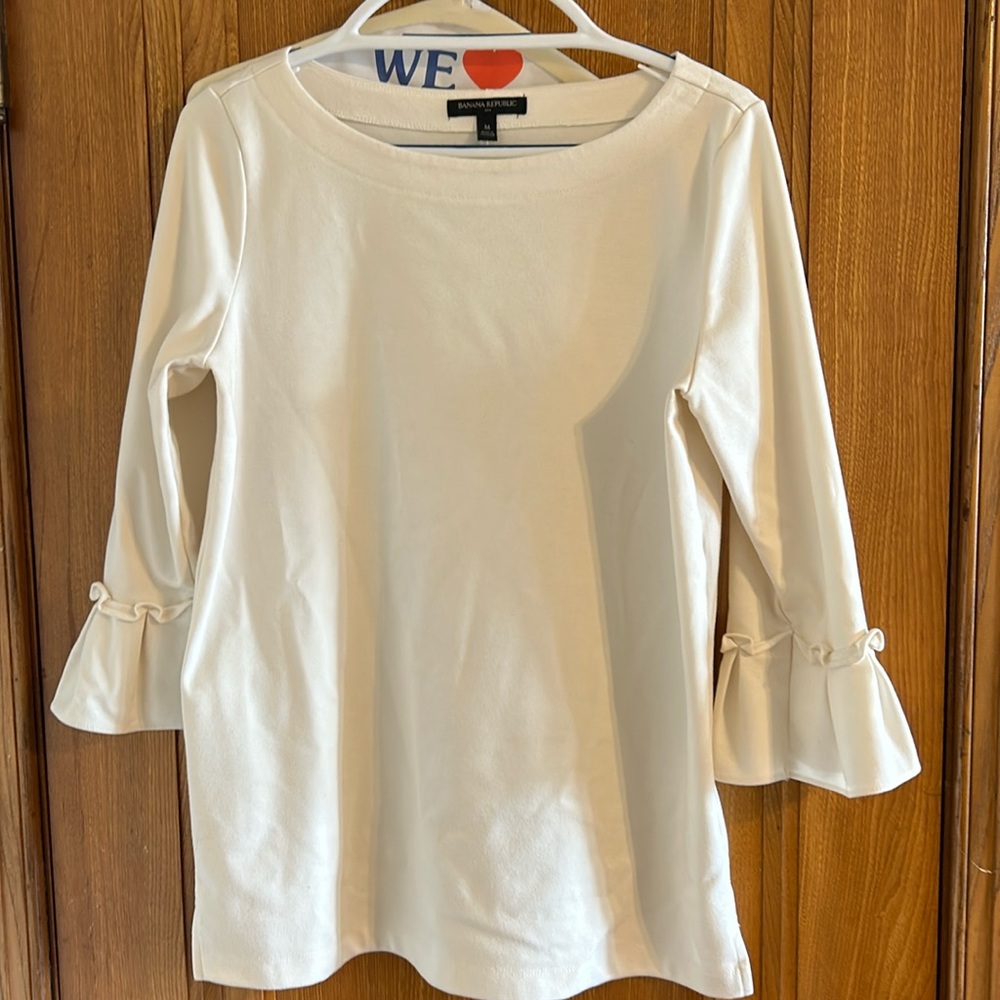 Cream Banana Republic blouse with ruffled sleeves